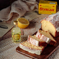 Lemon drizzle cake served with fresh lemons and Welsh limoncello